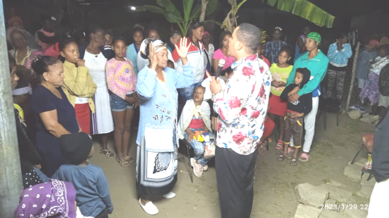 group of people being ministered to in closed nation