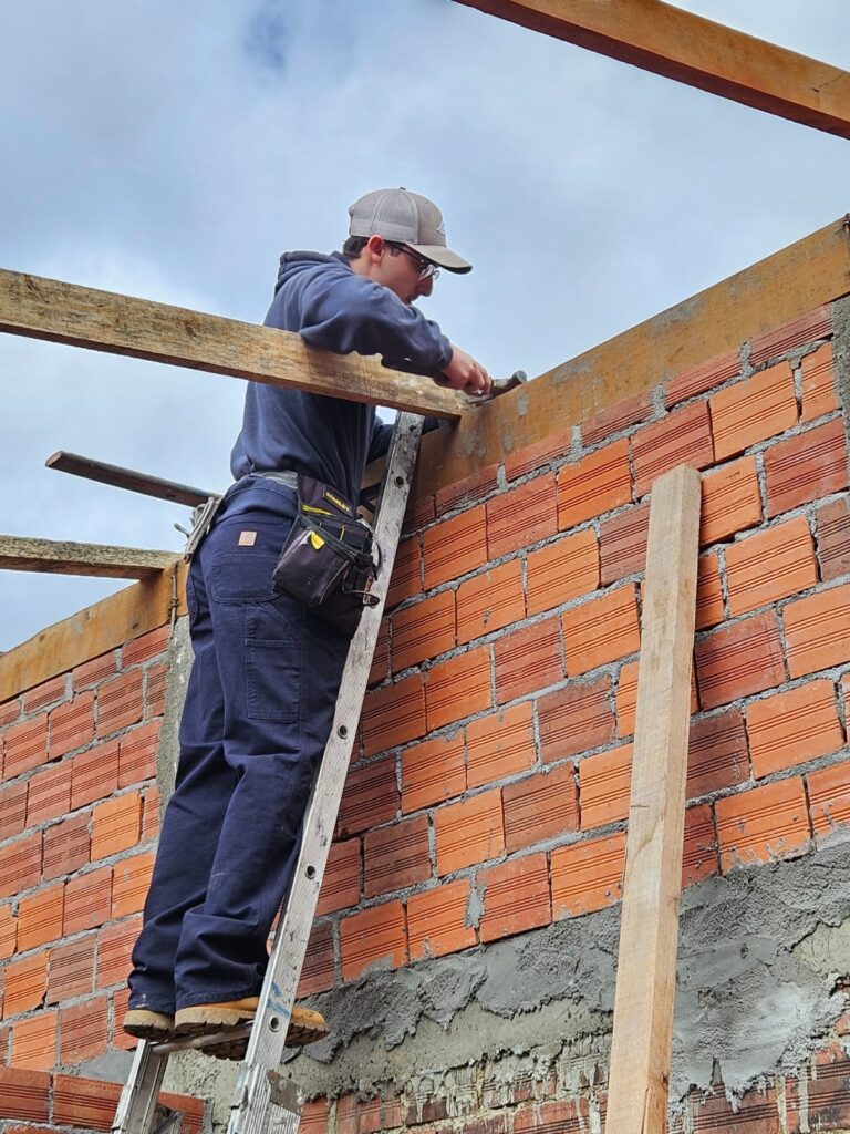 our executive missions director helping in construction