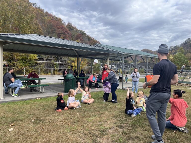 service trip team members helping children